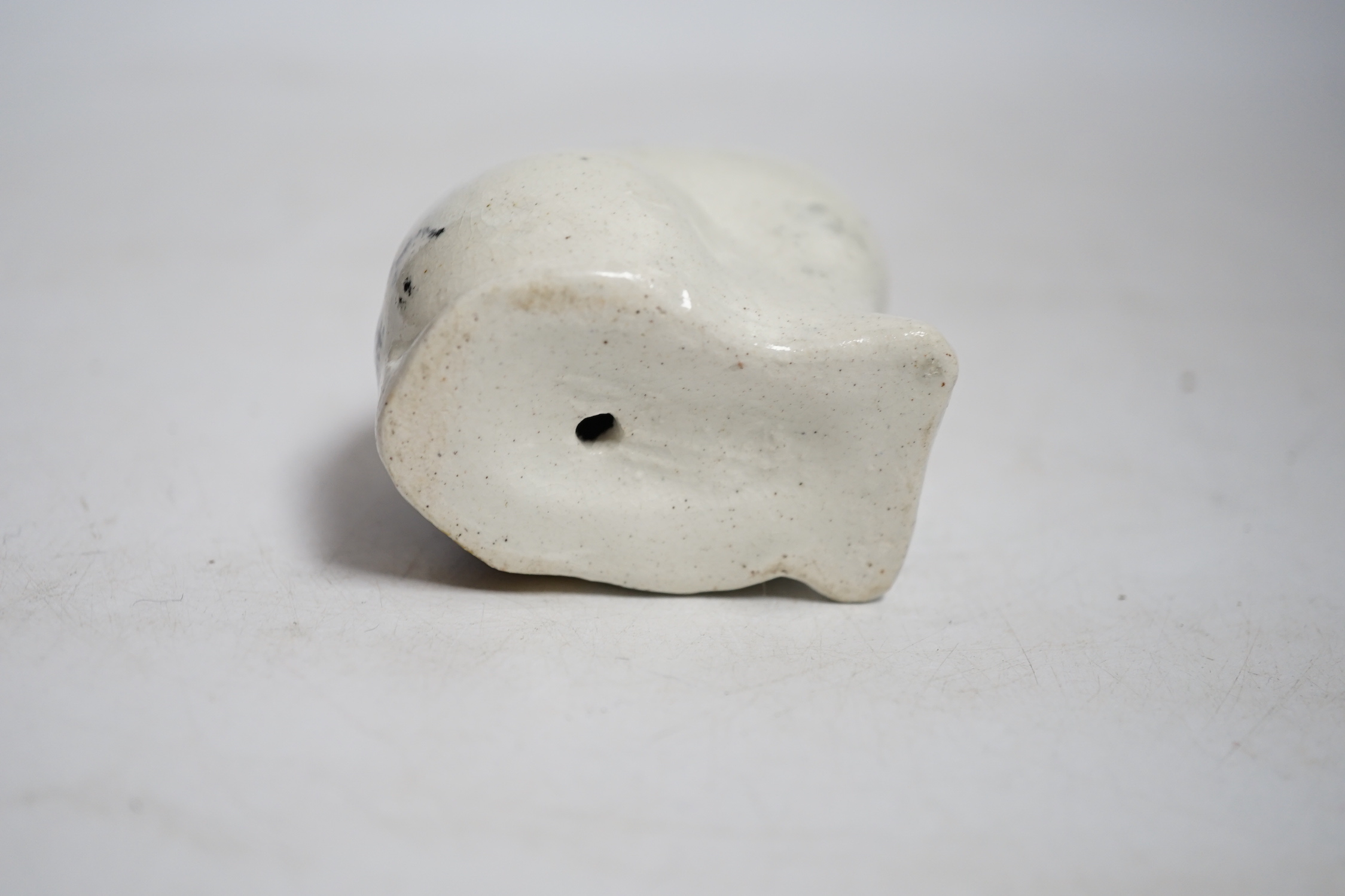 A Staffordshire pottery cat with yellow collar, mid 19th century, height 9.5cm